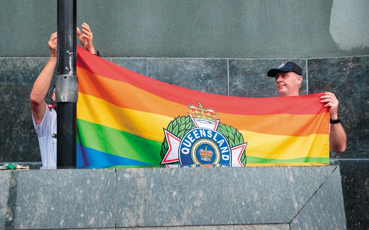 A flag is raised at the Queensland Police Headquarters in Brisbane.